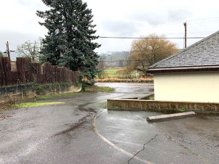 Paved one-way drive thru parking lot