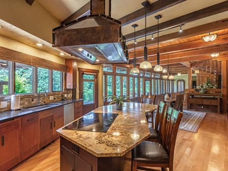 Granite kitchen with custom copper hood and lake view