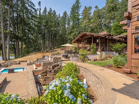 Terraced lakeside pool complex and pavilion