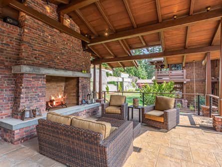 Poolside pavilion with massive outdoor fireplace