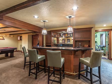 Basement family room with bar & pool table